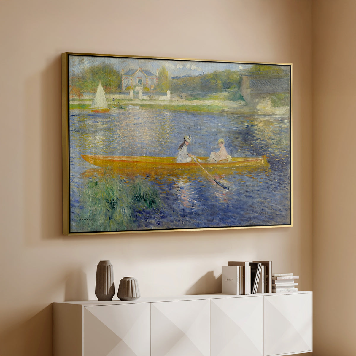Gold floater framed canvas of The Skiff (La Yole), 1875 by Pierre-Auguste Renoir, featuring an impressionist boating scene with people relaxing in a narrow skiff above a console cabinet in a minimalist entryway.