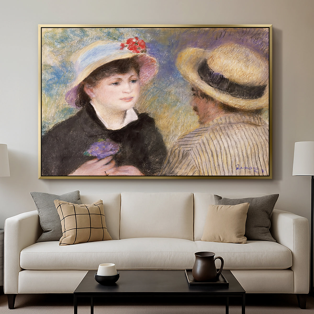 Boating Couple (Aline Charigot and Renoir), c. 1881 by Pierre-Auguste Renoir displayed in a gold floater framed canvas above a sofa in a clean living room.