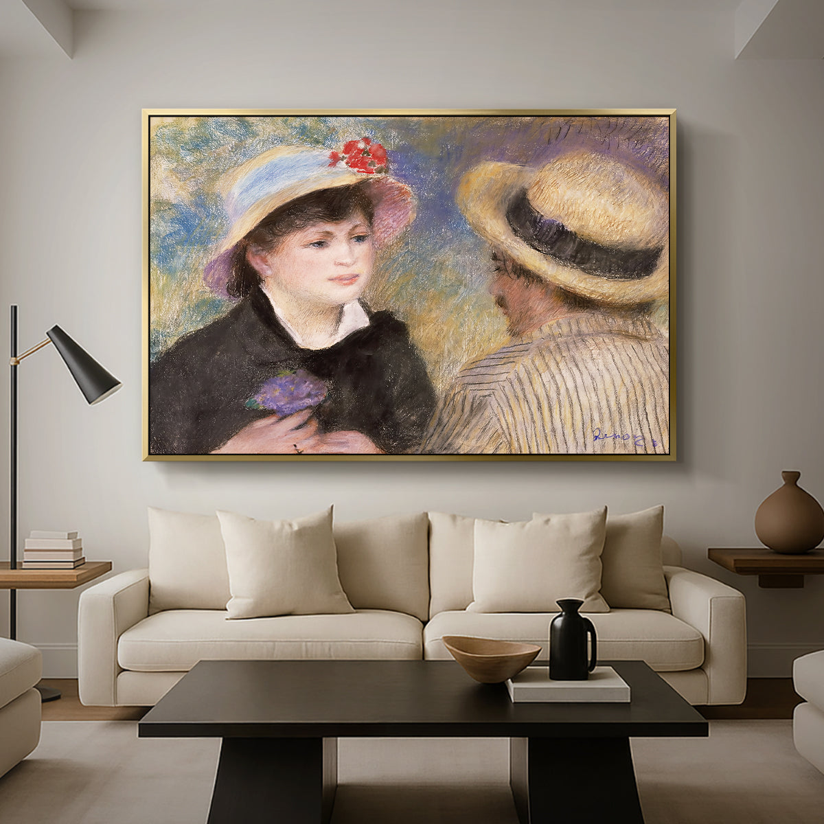 Boating Couple (Aline Charigot and Renoir), c. 1881 by Pierre-Auguste Renoir as a gold floater framed canvas featuring a close-up of a couple seated together outdoors with hats and soft sunlight, displayed above a sofa in a modern living room.