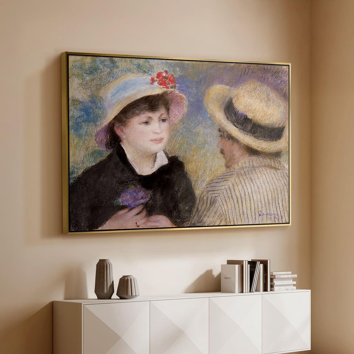 Gold floater framed canvas of Boating Couple (Aline Charigot and Renoir), c. 1881 by Pierre-Auguste Renoir, featuring an intimate portrait of man and woman sitting side by side in outdoor setting above a console cabinet in a minimalist entryway.