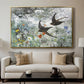 Common Swifts, 1886 by Bruno Liljefors displayed in a gold floater framed canvas above a sofa in a clean living room.