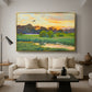 Flying Duck at Sunset, 1924 by Bruno Liljefors as a gold floater framed canvas featuring a wild duck flying over a sunset marsh with trees, displayed above a sofa in a modern living room.