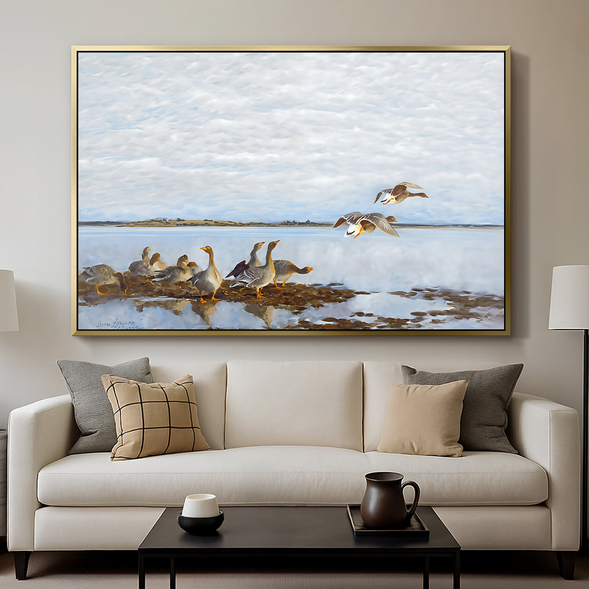 Greylag Geese (Grågäss), 1922 by Bruno Liljefors displayed in a gold floater framed canvas above a sofa in a clean living room.