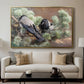 Hooded Crows (Kråkor), 1891 by Bruno Liljefors displayed in a gold floater framed canvas above a sofa in a clean living room.