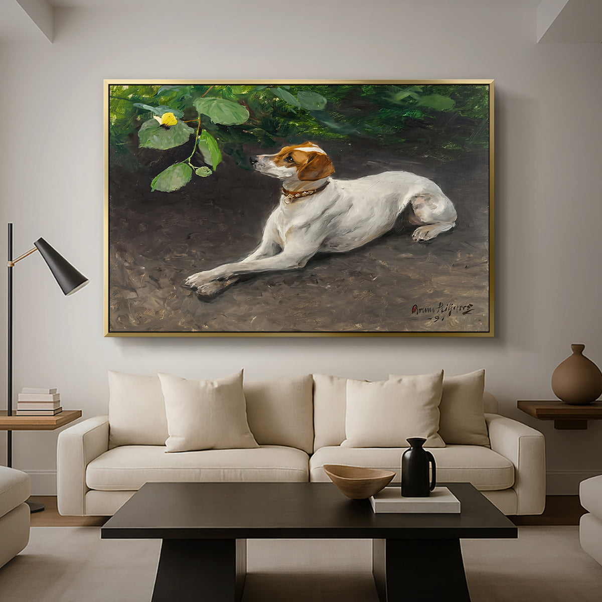 Portrait of a Dog, 1891 by Bruno Liljefors as a gold floater framed canvas featuring a dog lying on ground with head raised in natural outdoor setting, displayed above a sofa in a modern living room.