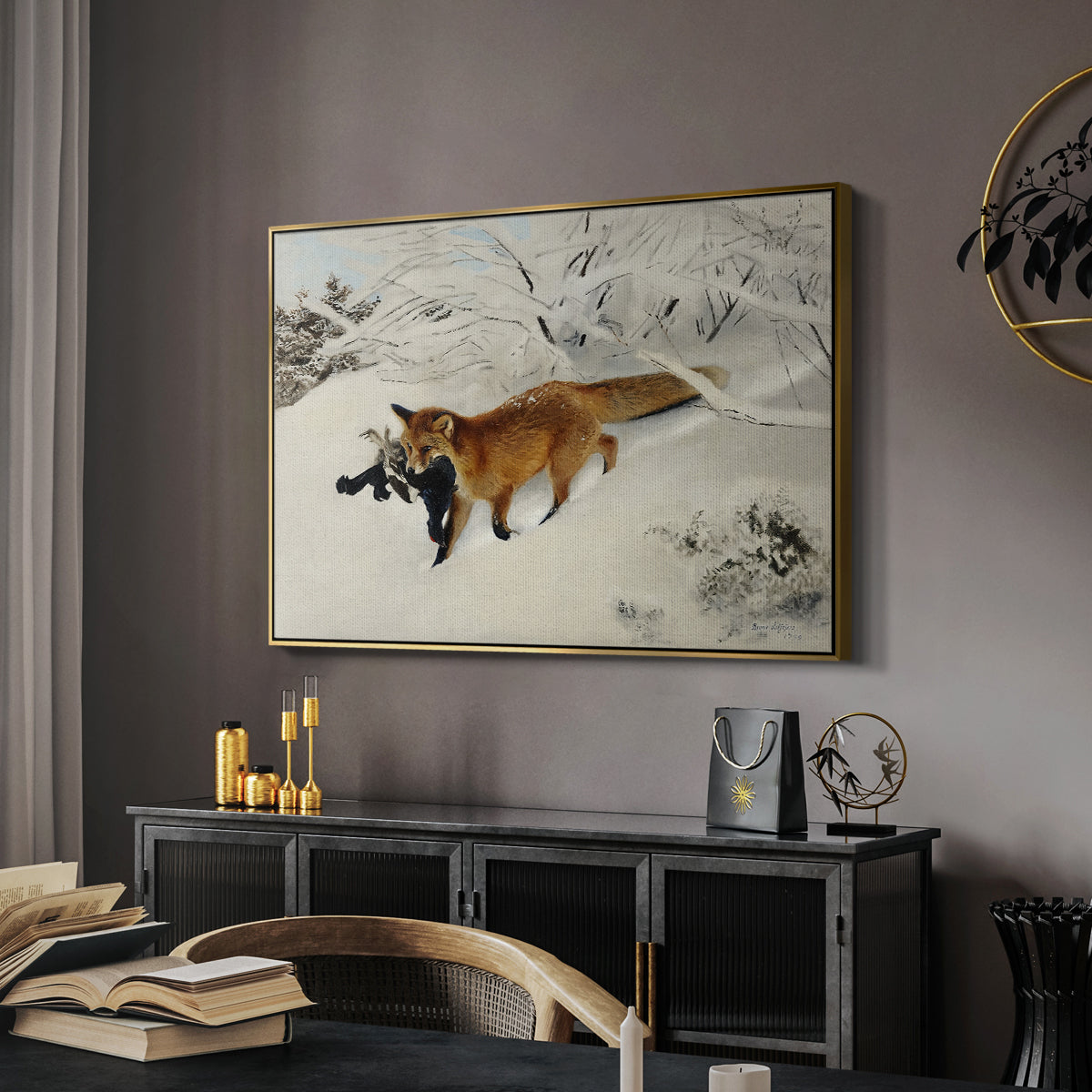 Fox in Snow Landscape, 1900 by Bruno Liljefors in a gold floater framed canvas featuring a red fox crossing snow-covered ground under pale sky, displayed above a desk in a dark home office interior.