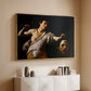 Gold floater framed canvas of David with the Head of Goliath (Vienna Version), c. 1607 by Caravaggio, featuring a biblical scene of David gripping Goliath's head with dramatic lighting above a console cabinet in a minimalist entryway.