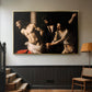 Gold floater framed canvas featuring an intense Baroque scene of suffering with strong light and shadow, displayed in a hallway near a staircase.