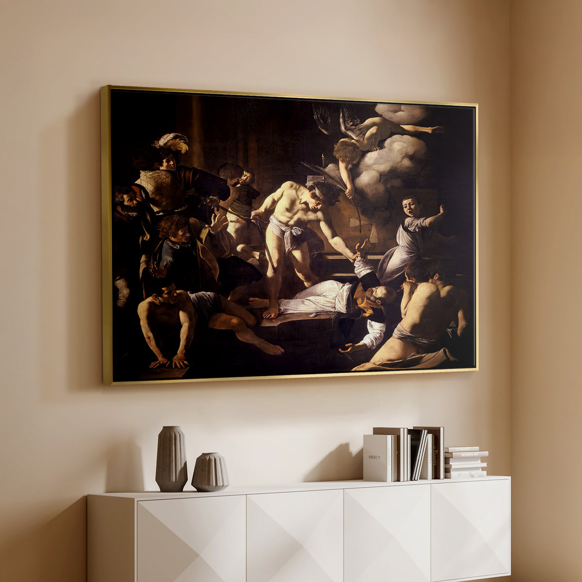 Gold floater framed canvas of The Martyrdom of Saint Matthew, 1599-1600 by Caravaggio, featuring a dramatic moment of martyrdom with figures reacting in panic above a console cabinet in a minimalist entryway.