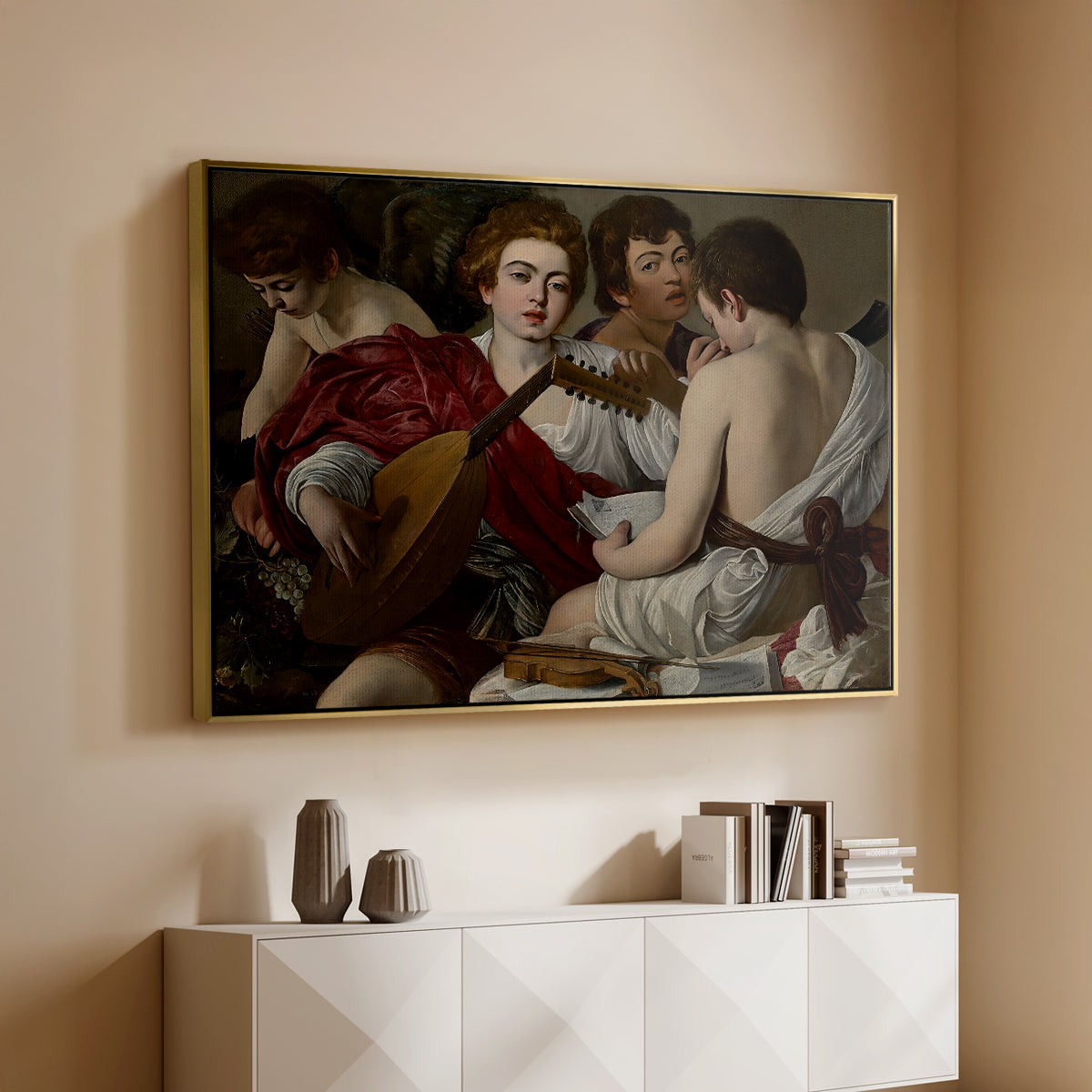 Gold floater framed canvas of The Musicians, c. 1595 by Caravaggio, featuring an ensemble of musicians holding lute and singing in close arrangement above a console cabinet in a minimalist entryway.