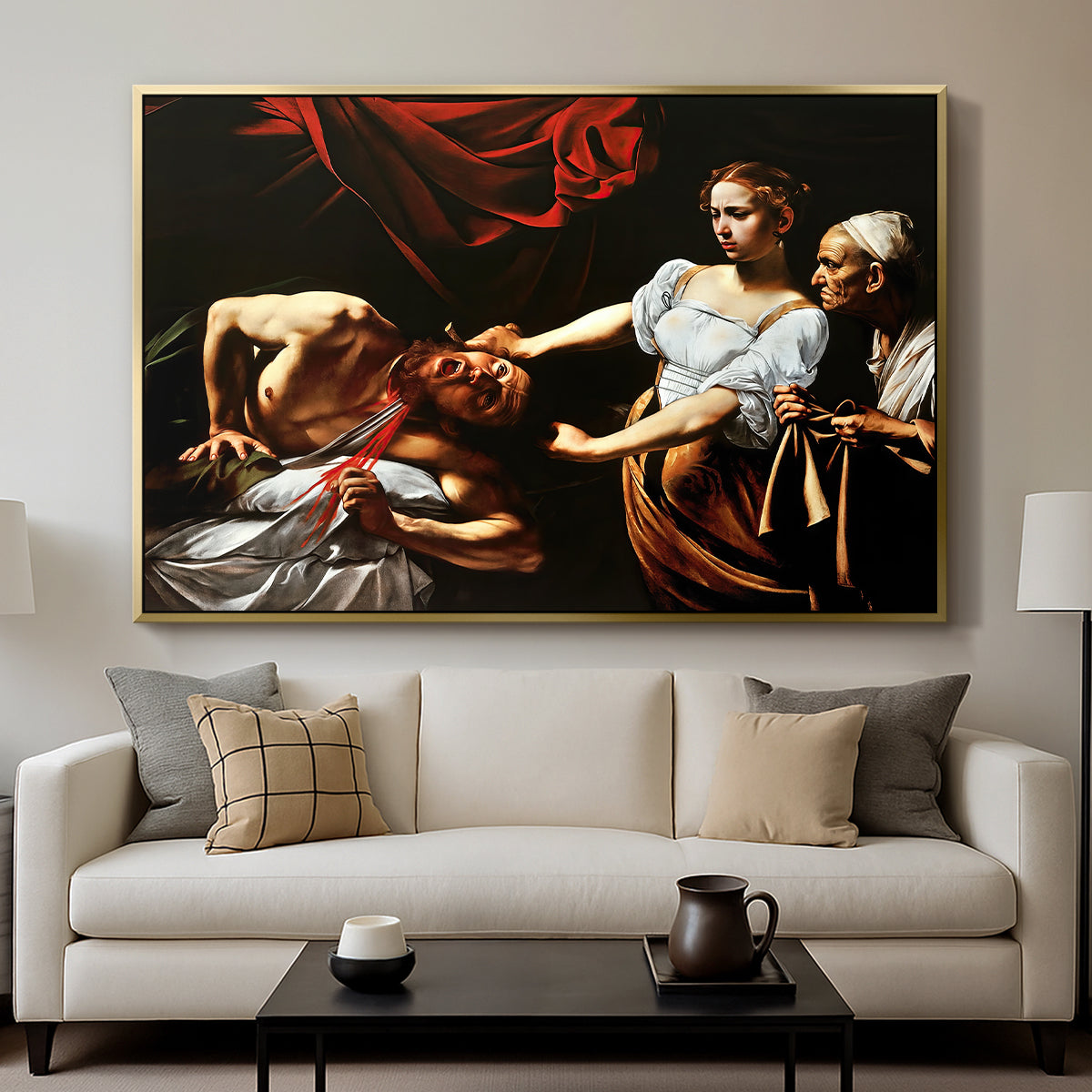 Judith Beheading Holofernes, c. 1599 by Caravaggio displayed in a gold floater framed canvas above a sofa in a clean living room.