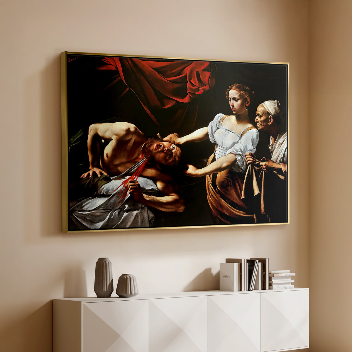 Gold floater framed canvas of Judith Beheading Holofernes, c. 1599 by Caravaggio, featuring a dramatic biblical scene of woman beheading man in bed above a console cabinet in a minimalist entryway.