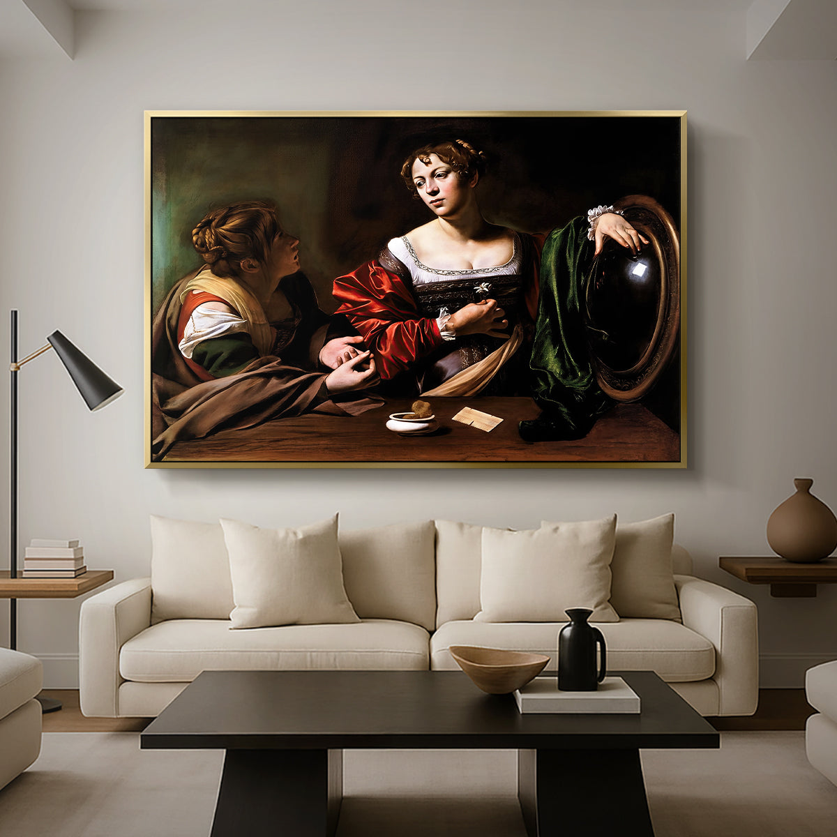 Martha and Mary Magdalene, c. 1598 by Caravaggio as a gold floater framed canvas featuring a two women seated together in conversation with symbolic objects on table, displayed above a sofa in a modern living room.
