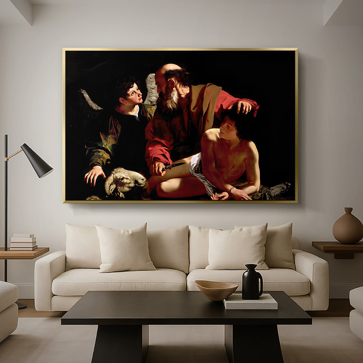 The Sacrifice of Isaac (Uffizi Version), c. 1603 by Caravaggio as a gold floater framed canvas featuring Abraham holding Isaac while angel intervenes to stop the sacrifice, displayed above a sofa in a modern living room.