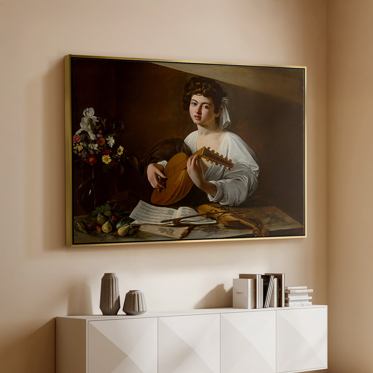Gold floater framed canvas of The Lute Player (Hermitage Version), c. 1596 by Caravaggio, featuring a portrait of lute player surrounded by still life arrangement above a console cabinet in a minimalist entryway.