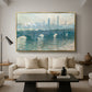 Waterloo Bridge, Gray Weather, 1900 by Claude Monet as a gold floater framed canvas featuring a hazy view of Waterloo Bridge over river in gray atmospheric light, displayed above a sofa in a modern living room.