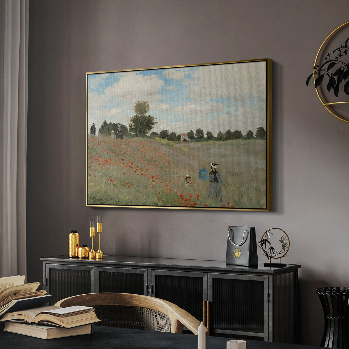 The Poppy Field near Argenteuil, 1873 by Claude Monet in a gold floater framed canvas featuring a bright meadow filled with poppies under open sky, displayed above a desk in a dark home office interior.
