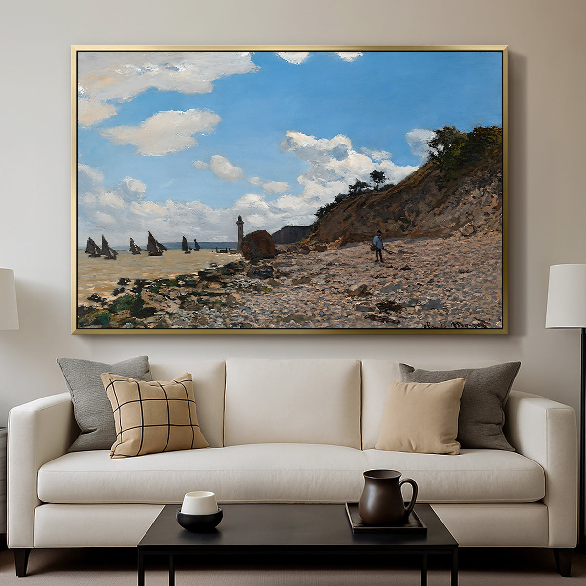 The Beach at Honfleur, 1864 by Claude Monet displayed in a gold floater framed canvas above a sofa in a clean living room.