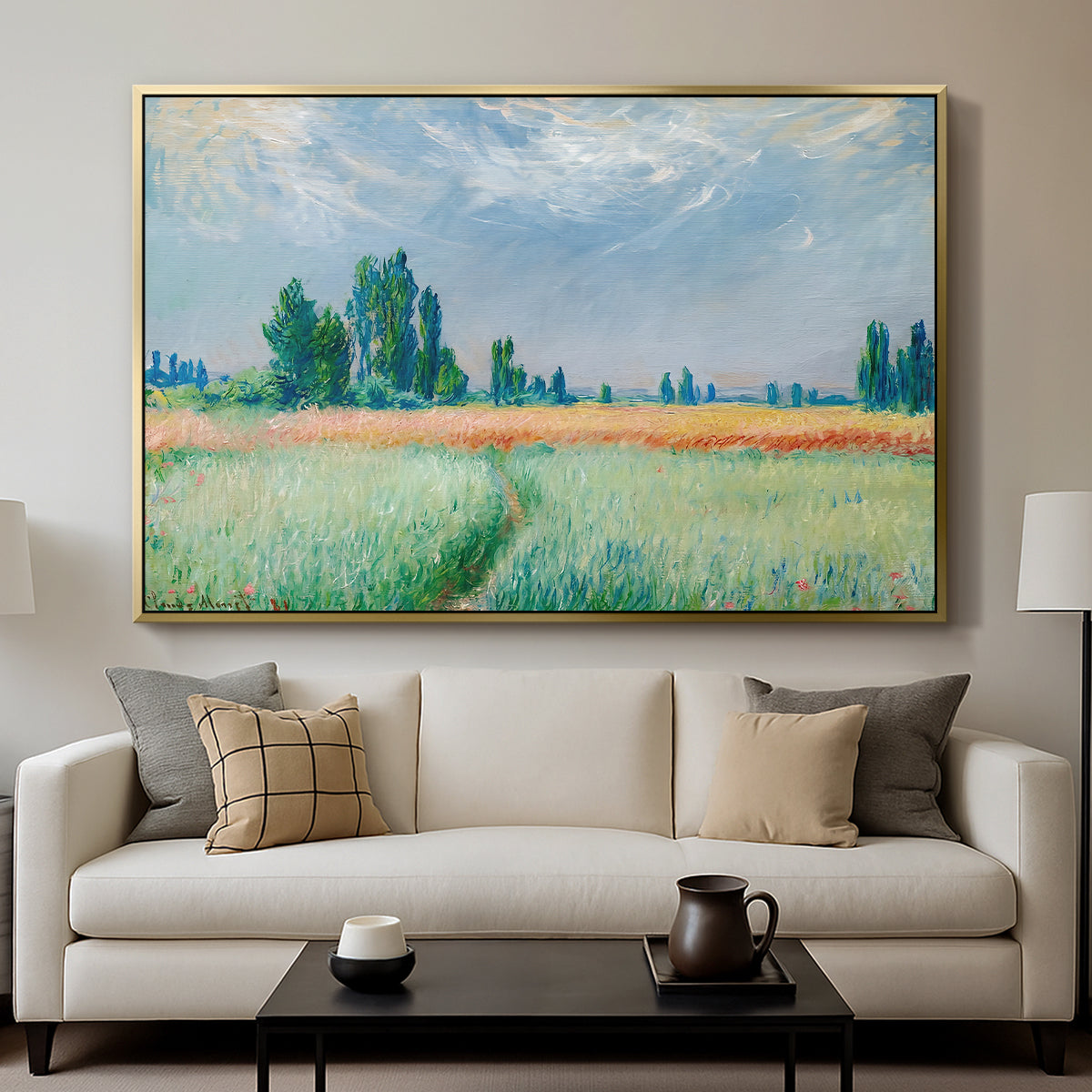 The Wheat Field (Champ de Blé), 1881 by Claude Monet displayed in a gold floater framed canvas above a sofa in a clean living room.