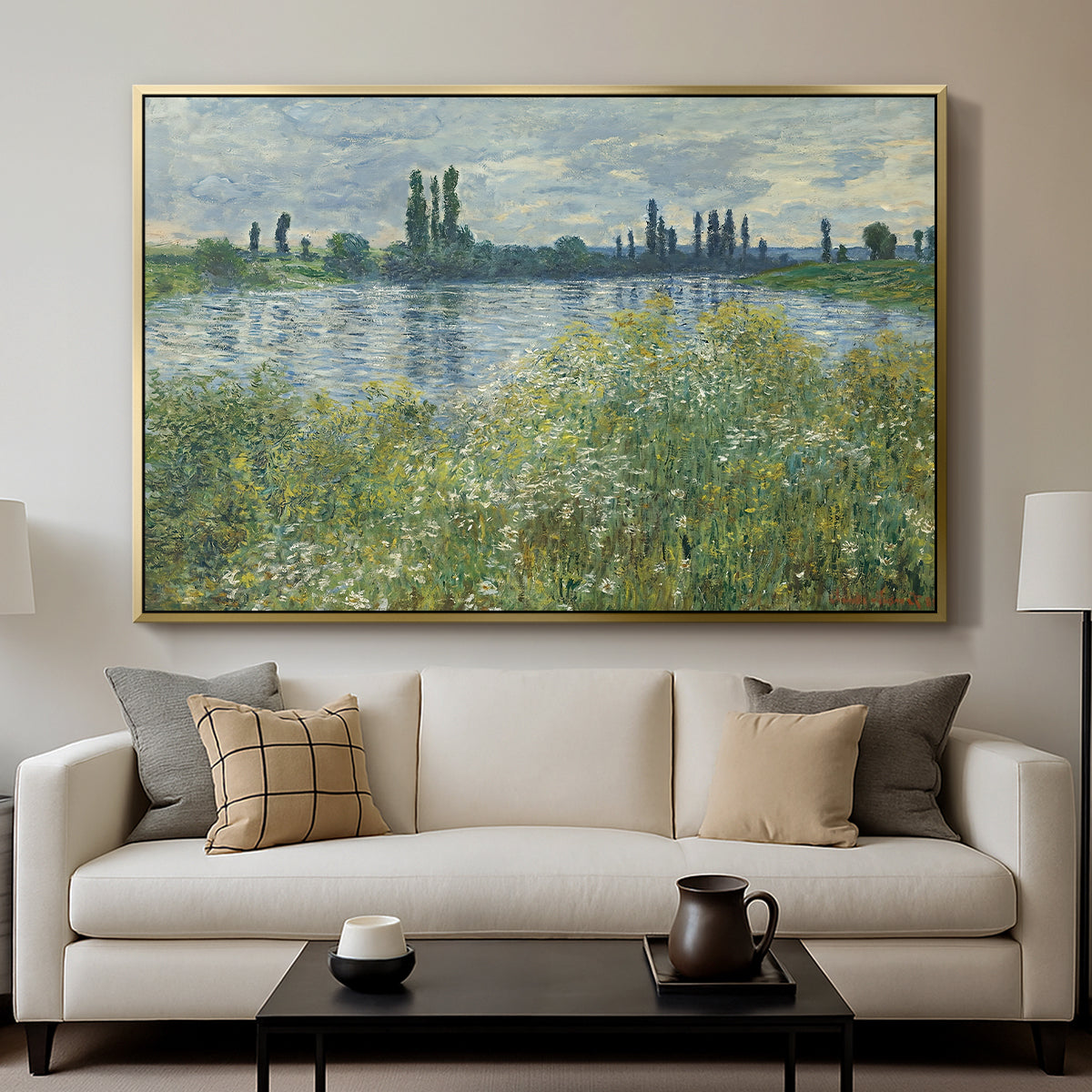 Banks of the Seine, Vétheuil, 1880 by Claude Monet displayed in a gold floater framed canvas above a sofa in a clean living room.