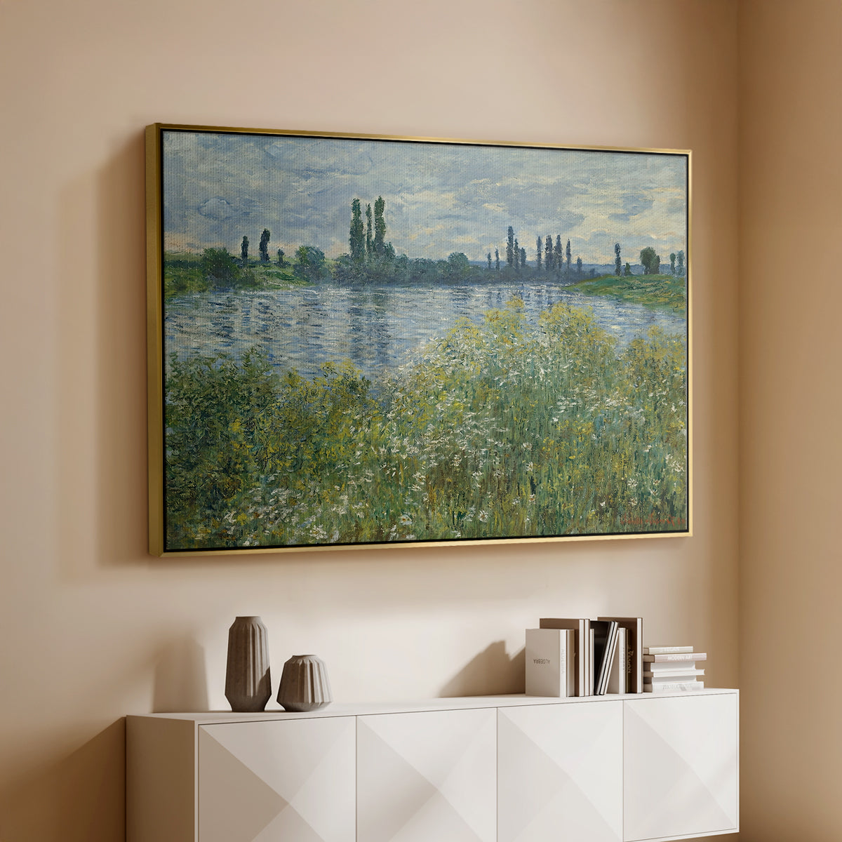 Gold floater framed canvas of Banks of the Seine, Vétheuil, 1880 by Claude Monet, featuring an impressionist view of Seine with reflections and greenery above a console cabinet in a minimalist entryway.