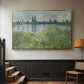 Gold floater framed canvas featuring a natural landscape with calm water and soft foliage, displayed in a hallway near a staircase.