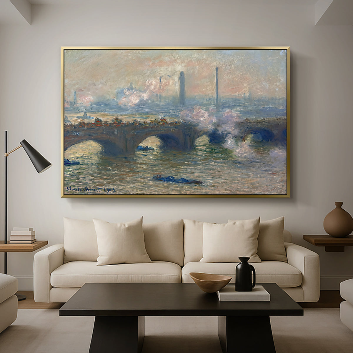 Waterloo Bridge, Gray Day, 1903 by Claude Monet as a gold floater framed canvas featuring a muted cityscape of bridge spanning river under overcast sky, displayed above a sofa in a modern living room.
