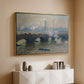 Gold floater framed canvas of Waterloo Bridge, Gray Day, 1903 by Claude Monet, featuring an impressionist depiction of bridge with soft gray tones and haze above a console cabinet in a minimalist entryway.
