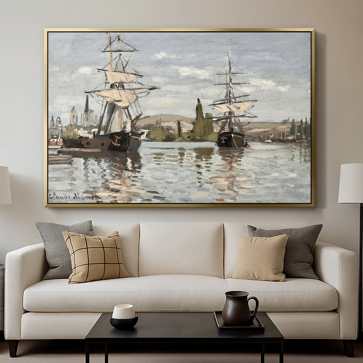 Ships Riding on the Seine at Rouen, 1872 by Claude Monet displayed in a gold floater framed canvas above a sofa in a clean living room.