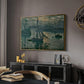 Sunrise (Marine), 1873 by Claude Monet in a gold floater framed canvas featuring an early morning harbor scene with boats and diffused light, displayed above a desk in a dark home office interior.