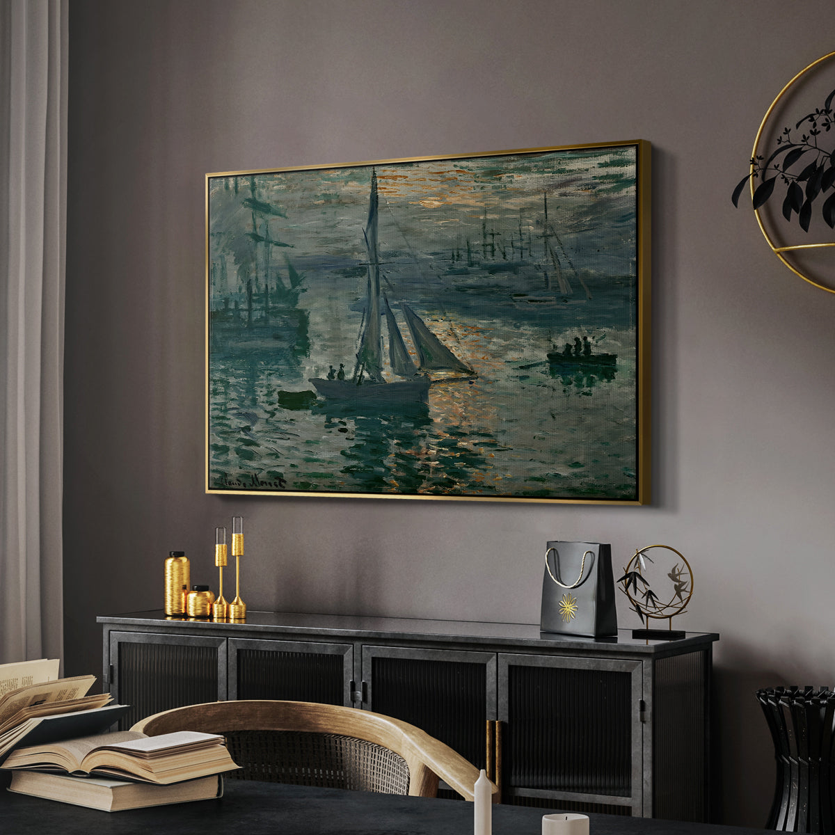 Sunrise (Marine), 1873 by Claude Monet in a gold floater framed canvas featuring an early morning harbor scene with boats and diffused light, displayed above a desk in a dark home office interior.