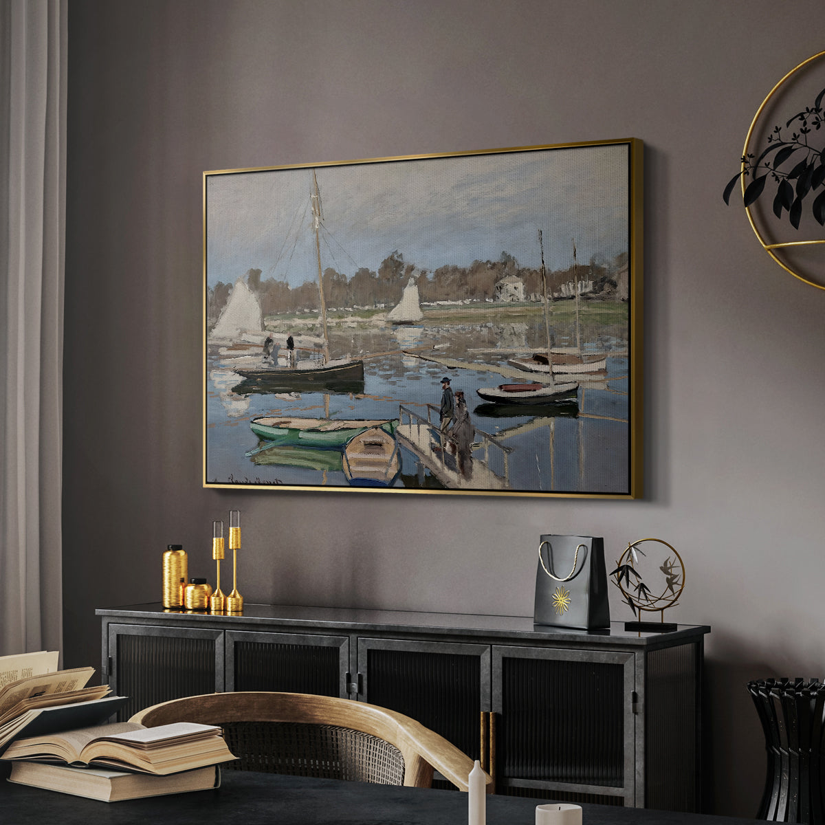 The Basin at Argenteuil, 1874 by Claude Monet in a gold floater framed canvas featuring a harbor basin filled with boats under soft sky, displayed above a desk in a dark home office interior.