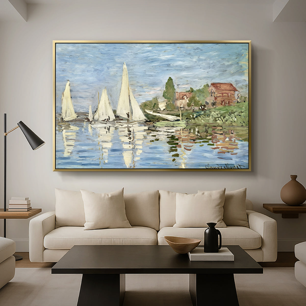 Regatta at Argenteuil, 1872 by Claude Monet as a gold floater framed canvas featuring colorful sailboats racing across river under bright sky, displayed above a sofa in a modern living room.