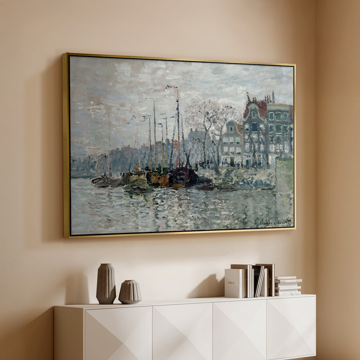 Gold floater framed canvas of View of the Prins Hendrikkade and Kromme Waal in Amsterdam, 1874 by Claude Monet, featuring an impressionist cityscape of canal with ships and architecture above a console cabinet in a minimalist entryway.