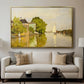 Houses on the Achterzaan, 1871 by Claude Monet displayed in a gold floater framed canvas above a sofa in a clean living room.