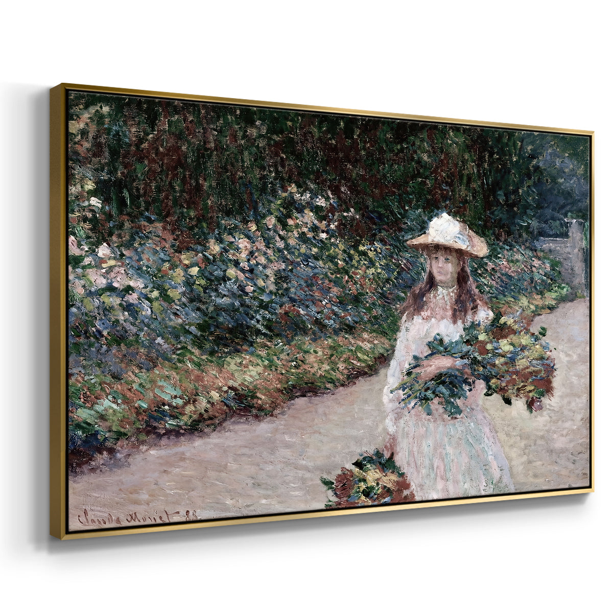 Angled view of Young Girl in the Garden at Giverny, 1888 by Claude Monet in a gold floater framed canvas.