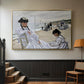 Gold floater framed canvas featuring a coastal leisure scene with figures looking out to sea, displayed in a hallway near a staircase.