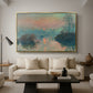 Sunset on the Seine at Lavacourt, Winter Effect, 1880 by Claude Monet as a gold floater framed canvas featuring a glowing sunset over snowy river landscape with soft reflections, displayed above a sofa in a modern living room.