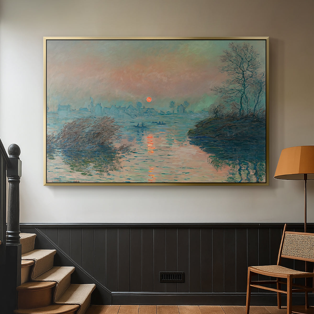 Gold floater framed canvas featuring an atmospheric landscape combining cold tones and warm sky, displayed in a hallway near a staircase.