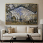The Gare Saint-Lazare, 1877 by Claude Monet displayed in a gold floater framed canvas above a sofa in a clean living room.