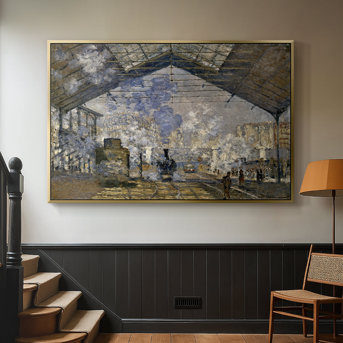 Gold floater framed canvas featuring a bustling transport hub with trains beneath glass roof, displayed in a hallway near a staircase.
