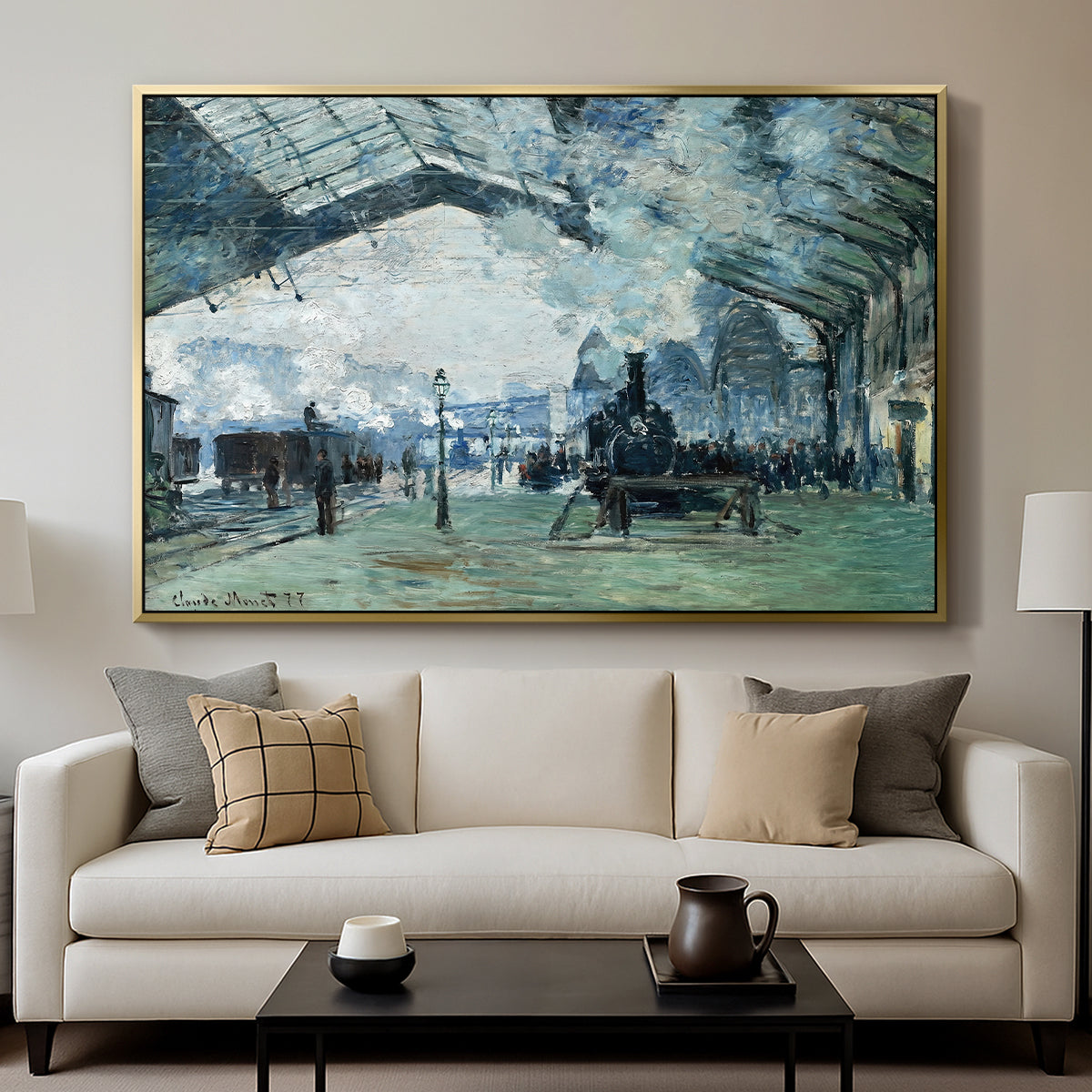 The Saint-Lazare Station, 1877 by Claude Monet displayed in a gold floater framed canvas above a sofa in a clean living room.