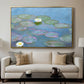Water Lilies (Nymphéas), 1897-1899 by Claude Monet displayed in a gold floater framed canvas above a sofa in a clean living room.
