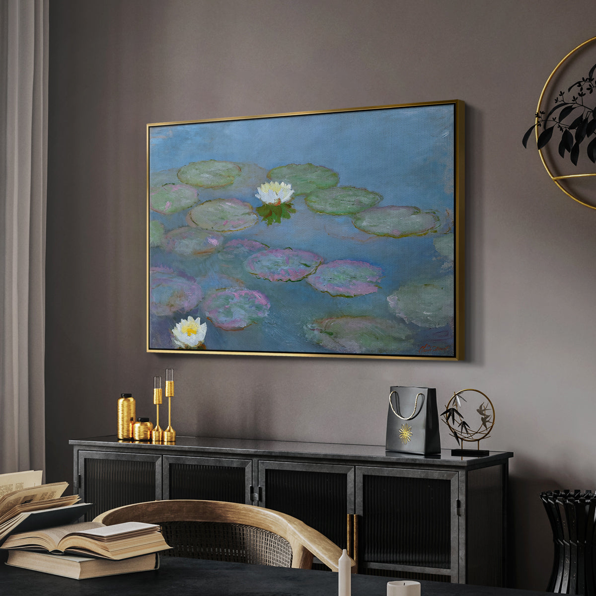 Water Lilies (Nymphéas), 1897-1899 by Claude Monet in a gold floater framed canvas featuring a tranquil water surface covered with blooming lilies, displayed above a desk in a dark home office interior.
