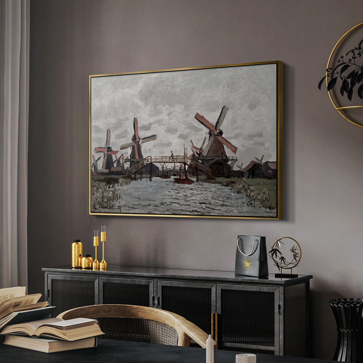 Windmills near Zaandam, 1871 by Claude Monet in a gold floater framed canvas featuring a countryside scene with traditional windmills and reflections, displayed above a desk in a dark home office interior.