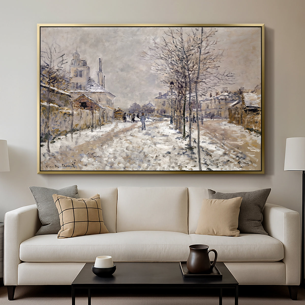 The Boulevard de Pontoise at Argenteuil, Snow Effect, 1875 by Claude Monet displayed in a gold floater framed canvas above a sofa in a clean living room.