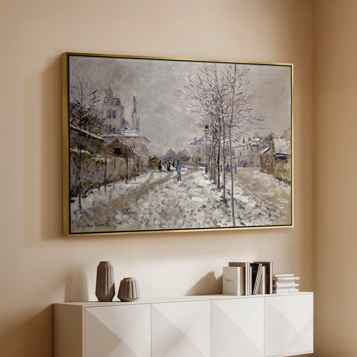 Gold floater framed canvas of The Boulevard de Pontoise at Argenteuil, Snow Effect, 1875 by Claude Monet, featuring an impressionist winter scene with road and bare trees above a console cabinet in a minimalist entryway.