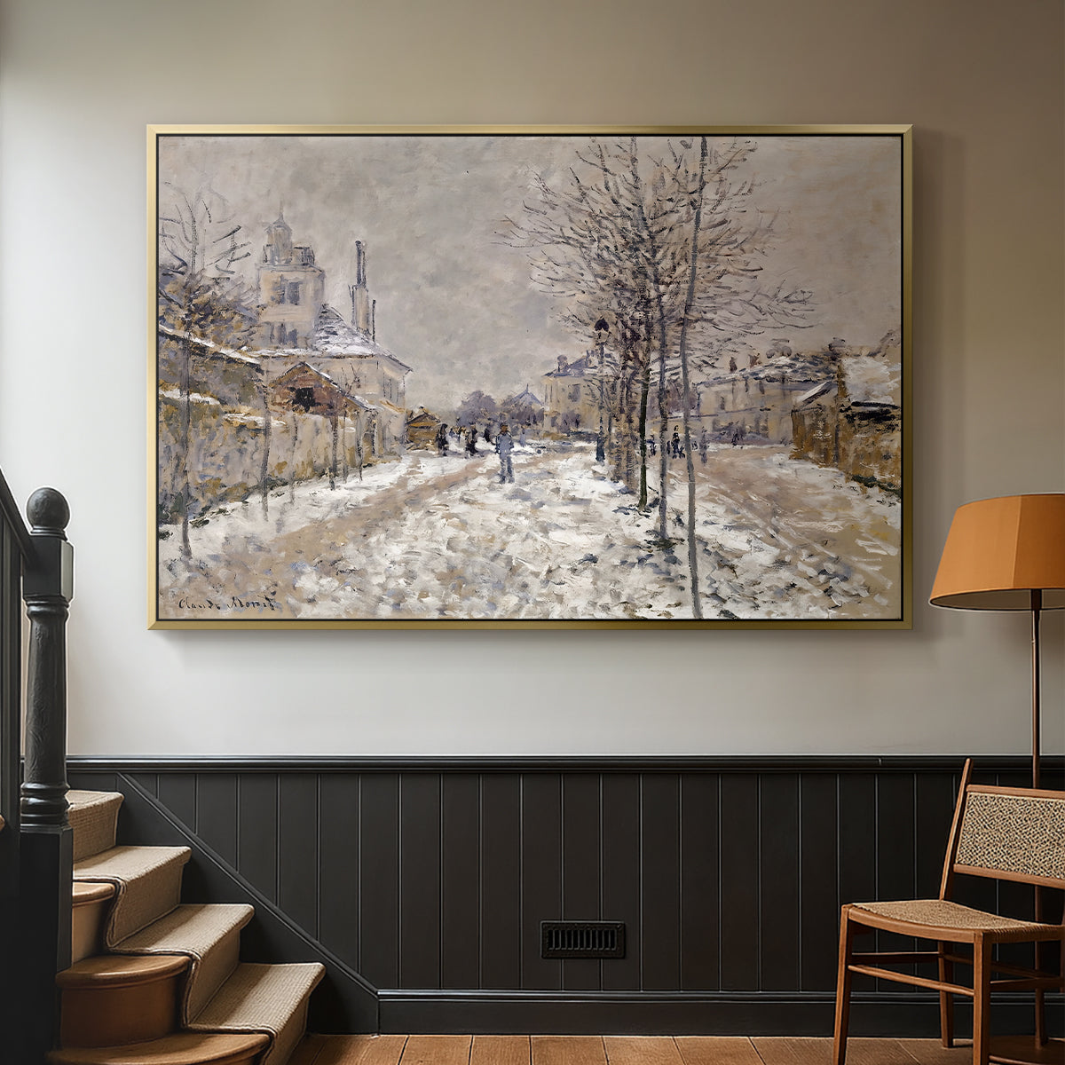 Gold floater framed canvas featuring an urban winter landscape with muted tones and soft light, displayed in a hallway near a staircase.