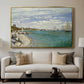 Regatta at Sainte-Adresse, 1867 by Claude Monet displayed in a gold floater framed canvas above a sofa in a clean living room.