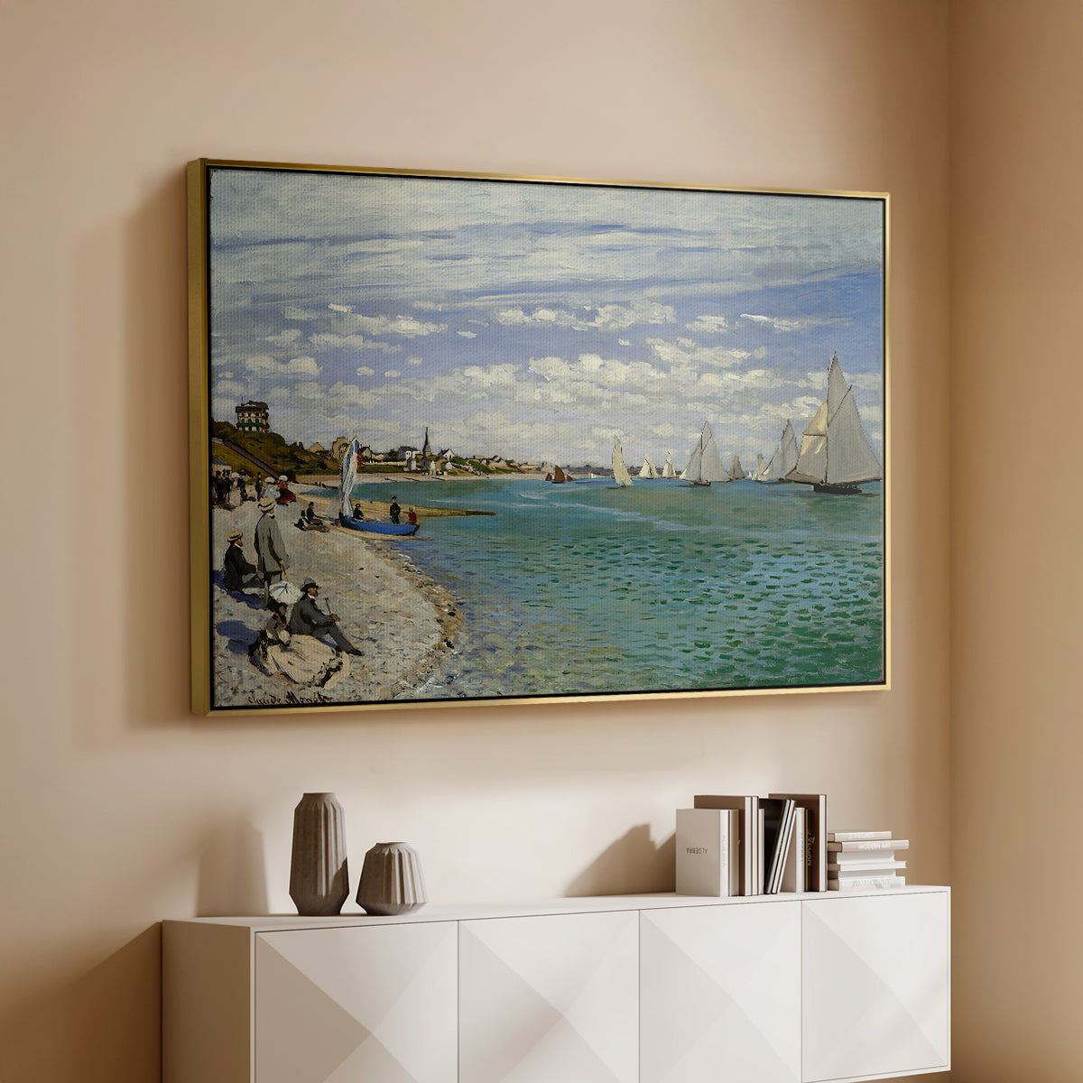 Gold floater framed canvas of Regatta at Sainte-Adresse, 1867 by Claude Monet, featuring a lively regatta scene with boats and people on beach above a console cabinet in a minimalist entryway.